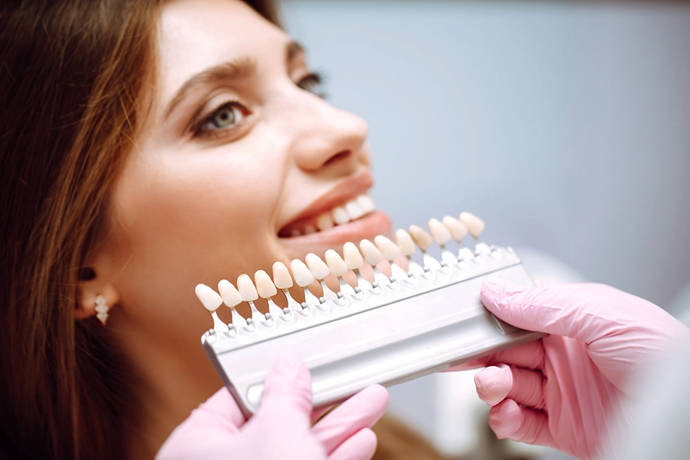 Contact Seibert Complete Dentistry. Woman at front desk of cincinnati office.