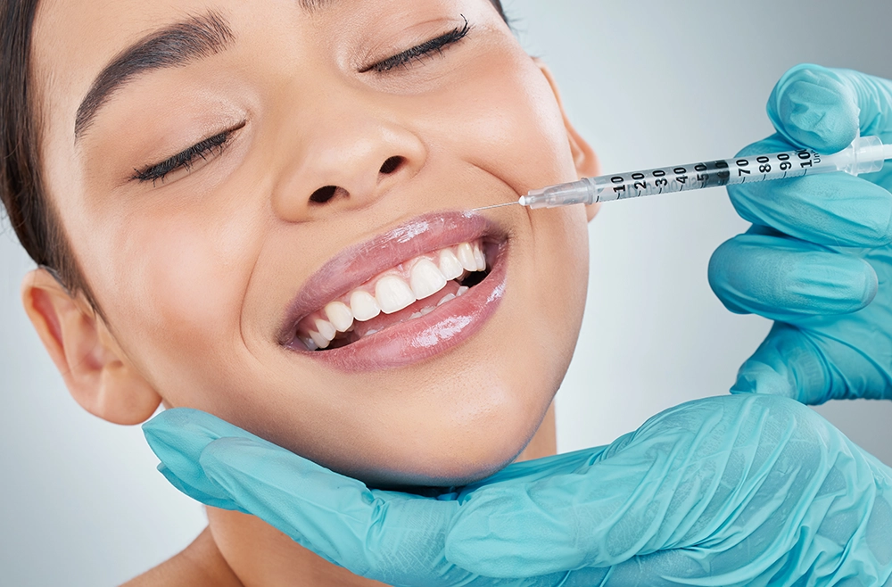Contact Seibert Complete Dentistry. Woman at front desk of cincinnati office.