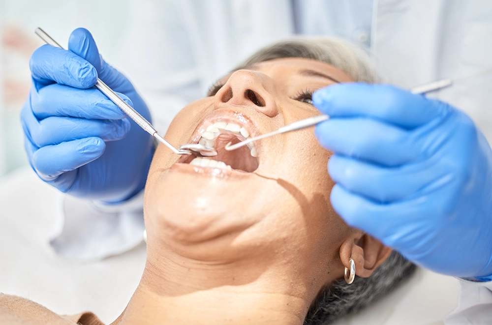 Contact Seibert Complete Dentistry. Woman at front desk of cincinnati office.