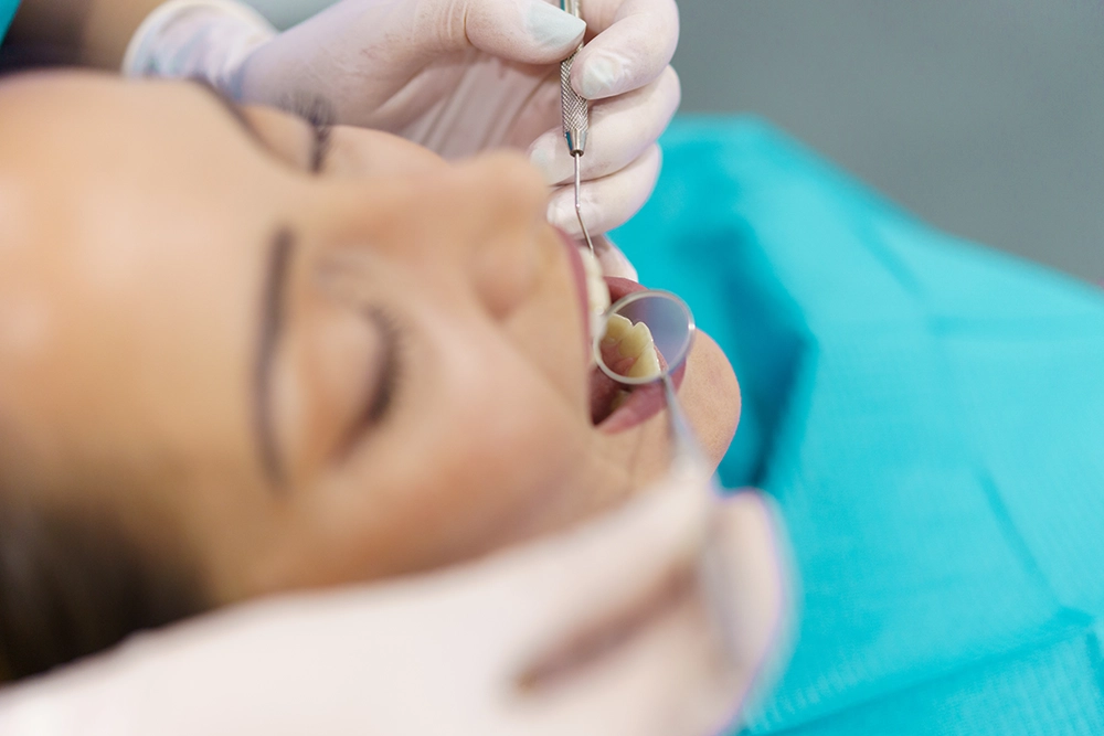 Contact Seibert Complete Dentistry. Woman at front desk of cincinnati office.